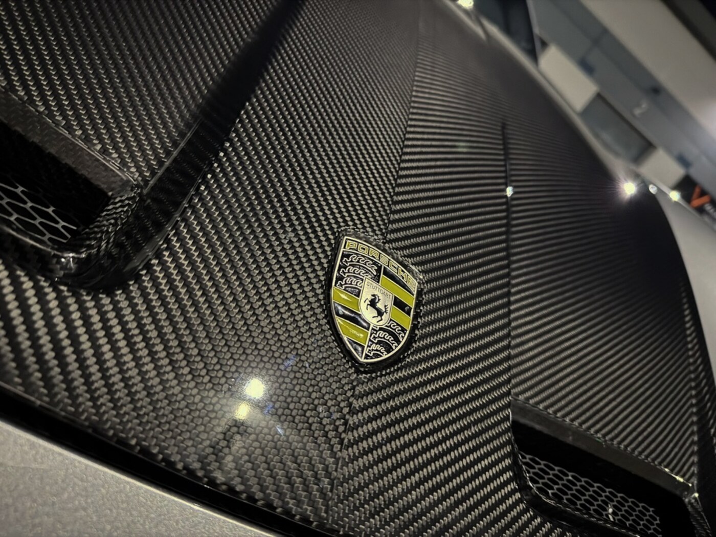 Close detail of Porsche carbon-fibre bodywork